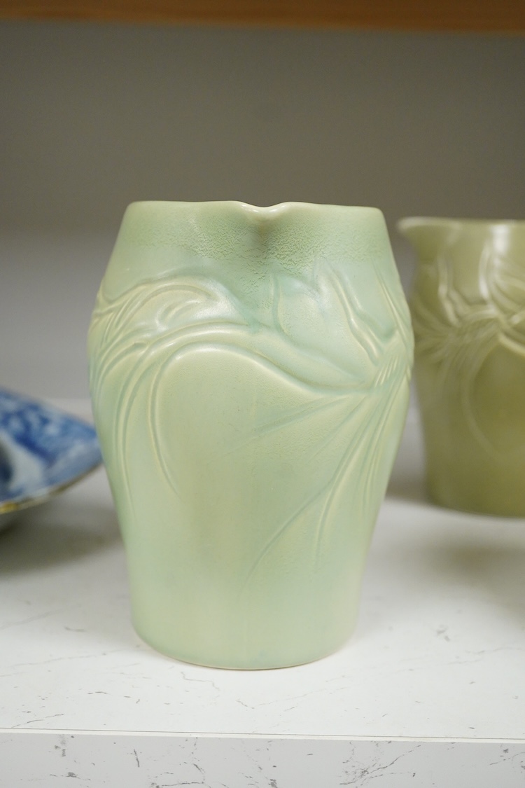 Three Susie Cooper green floral incised jugs, signed to the bases, tallest 16cm high